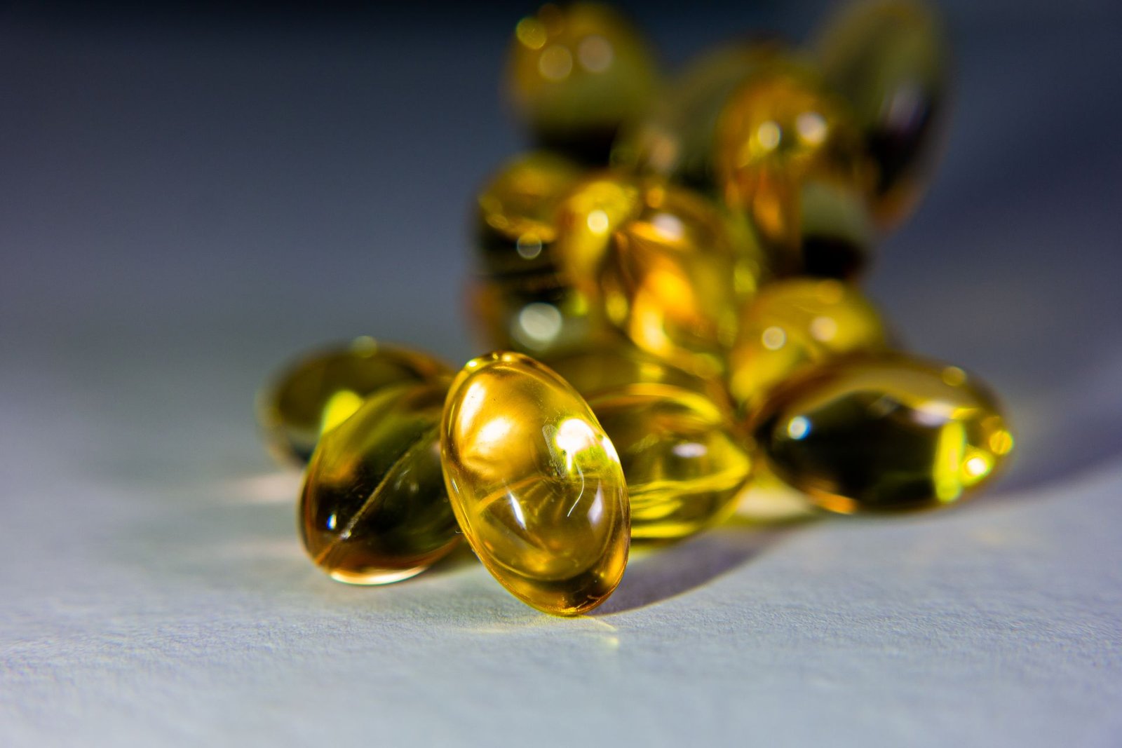 Close-up of golden softgel capsules